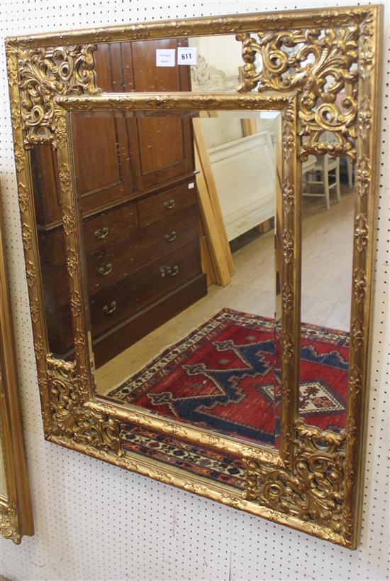 Carved giltwood marginal framed wall mirror(-)